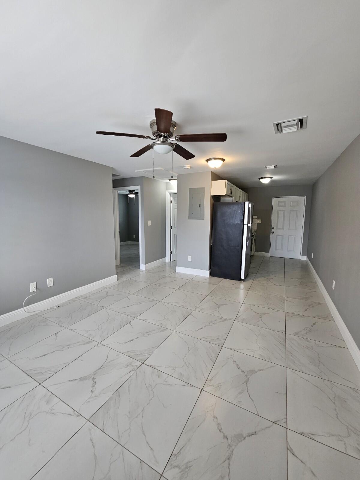 933 West 7th Street, Unit C Riviera Beach, FL 33404 - Photo 2 of 16 a view of a hallway with a garage