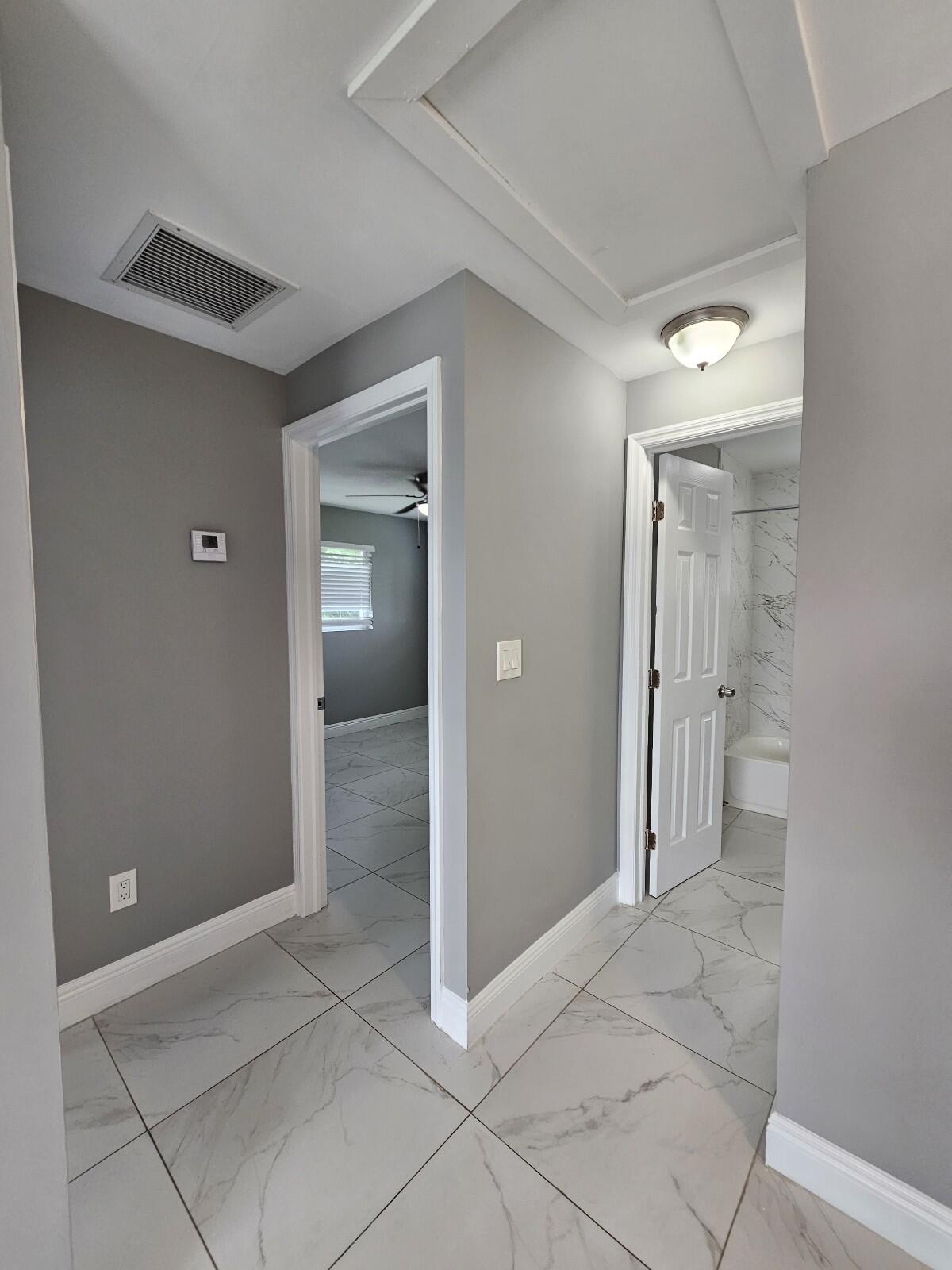 933 West 7th Street, Unit C Riviera Beach, FL 33404 - Photo 7 of 16 a view of entryway with bathroom