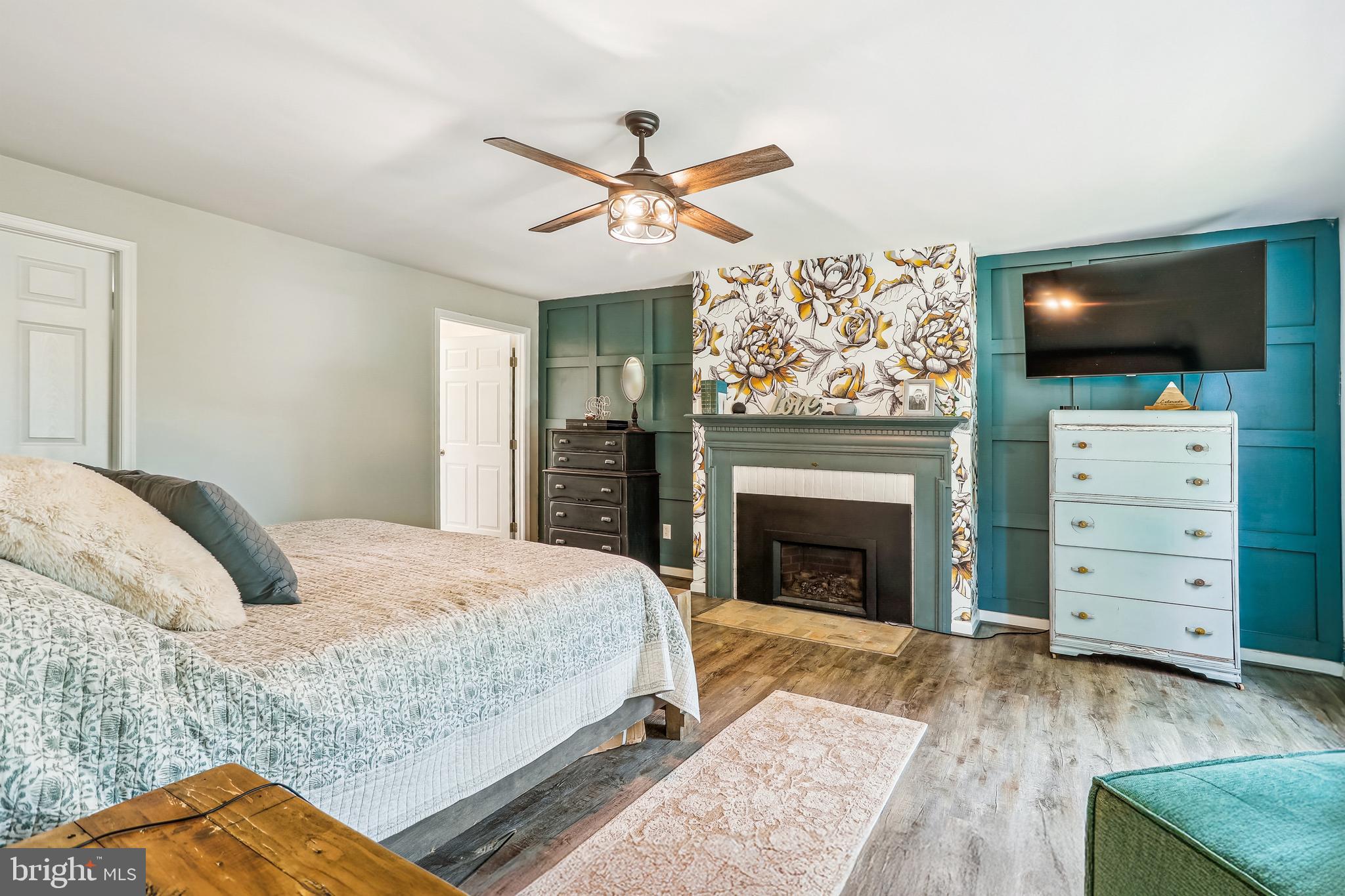 8730 Mapleville Road Union Bridge, MD 21791 - Photo 13 of 50 a bedroom with a bed and a flat screen tv