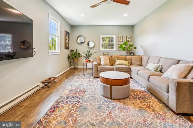 a living room with furniture and a window