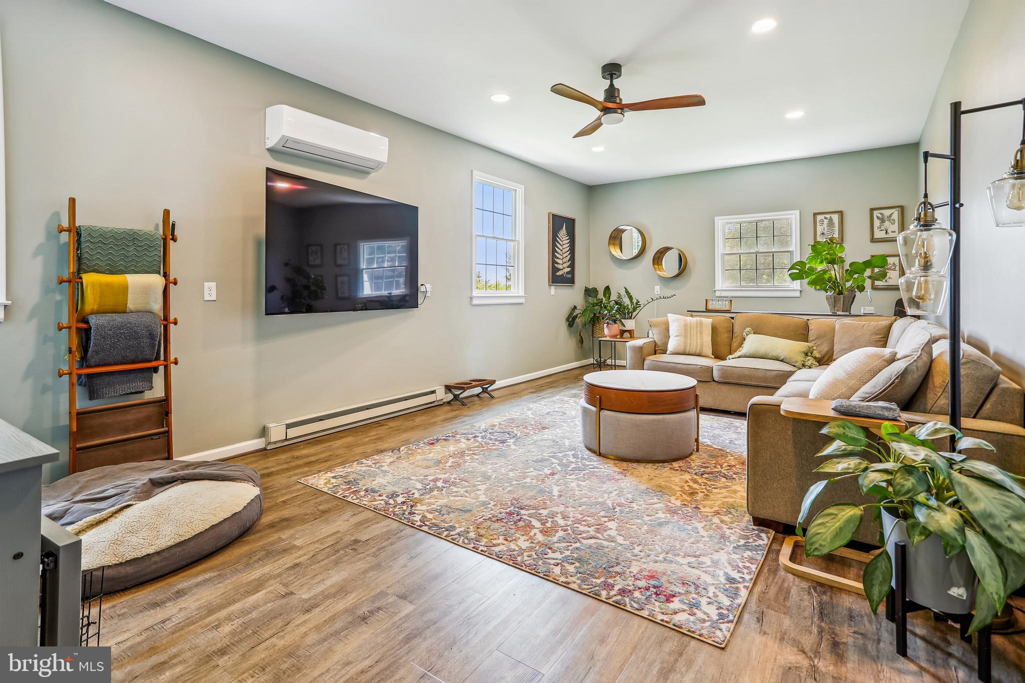 8730 Mapleville Road Union Bridge, MD 21791 - Photo 22 of 50 a living room with furniture and a flat screen tv