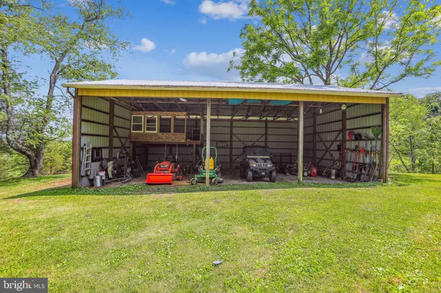 a view of a chair and table in front of house