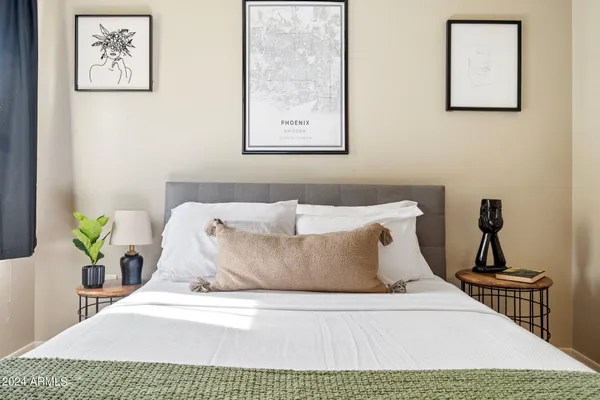 a close up of a bed in a bedroom