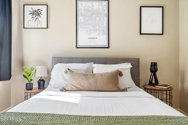 a close up of a bed in a bedroom