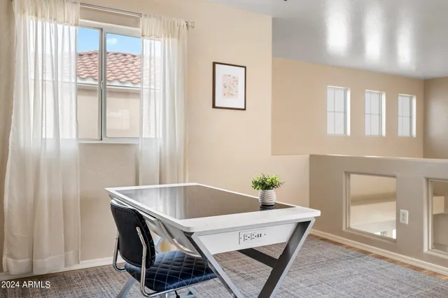 a dining room with furniture and window