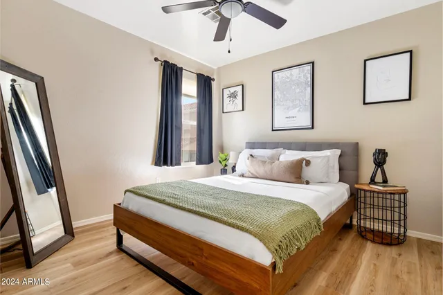 a bedroom with a bed and a window