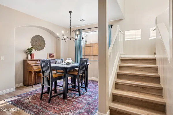 a view of a dining room that has a table and chairs