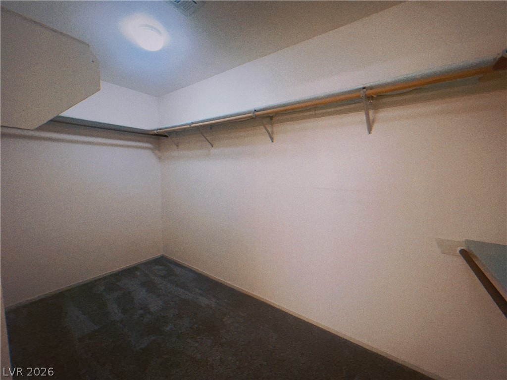 6250 West Flamingo Road, Unit 60 Las Vegas, NV 89103 - Photo 16 of 23 Functional walk-in closet offers ample storage with convenient hanging rods.