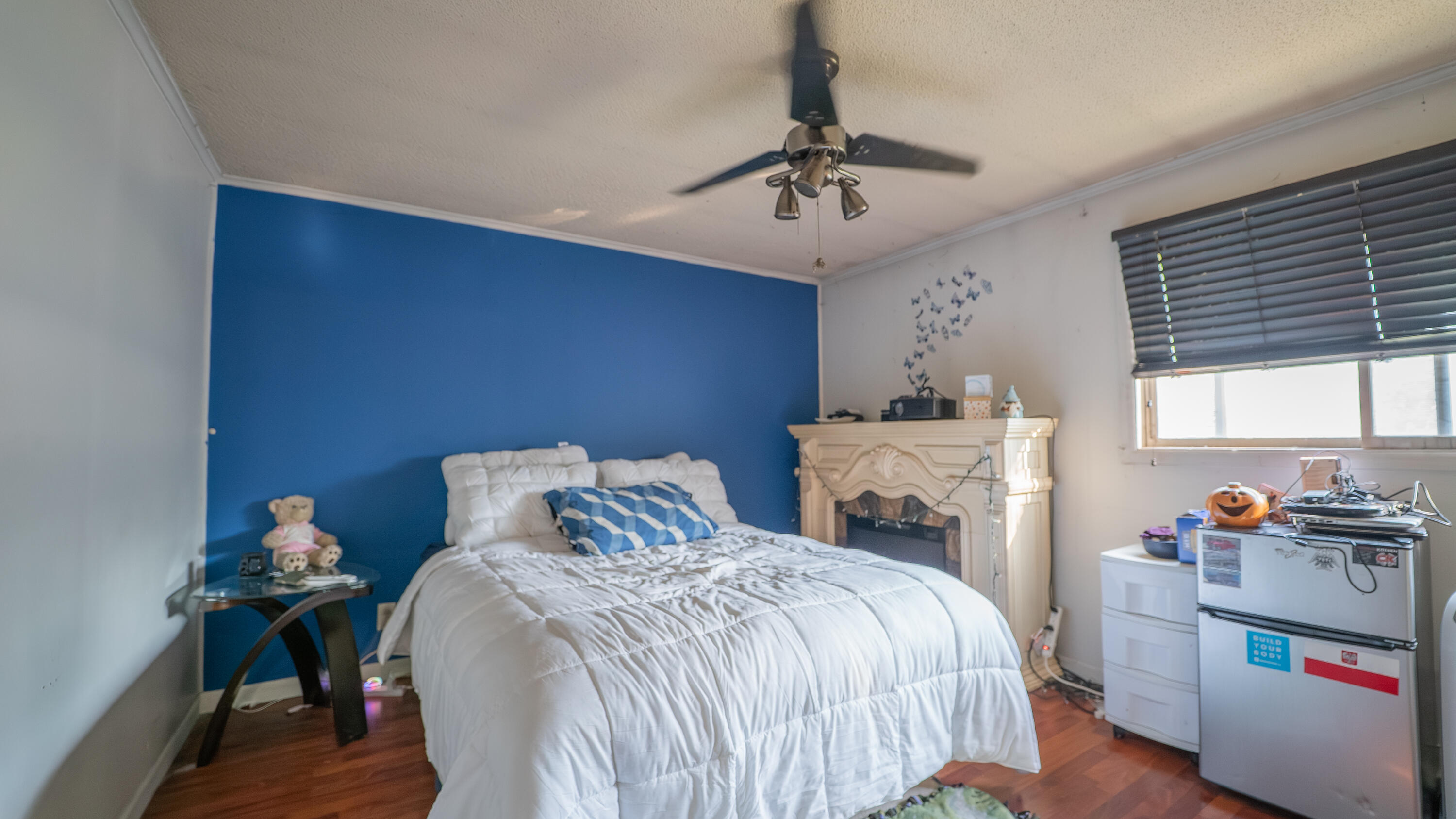 629 West South Street Crown Point, IN 46307 - Photo 16 of 23 a bedroom with a bed and a chandelier