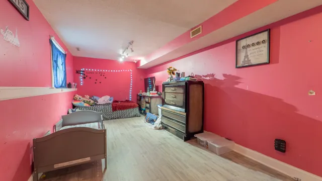 a bedroom with furniture and a bed