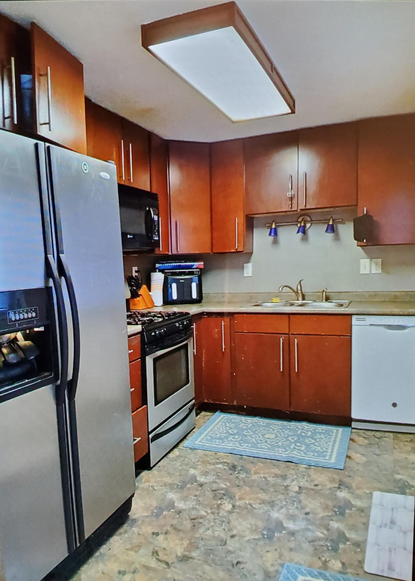 629 West South Street Crown Point, IN 46307 - Photo 7 of 23 a kitchen with stainless steel appliances granite countertop a refrigerator a sink and a stove