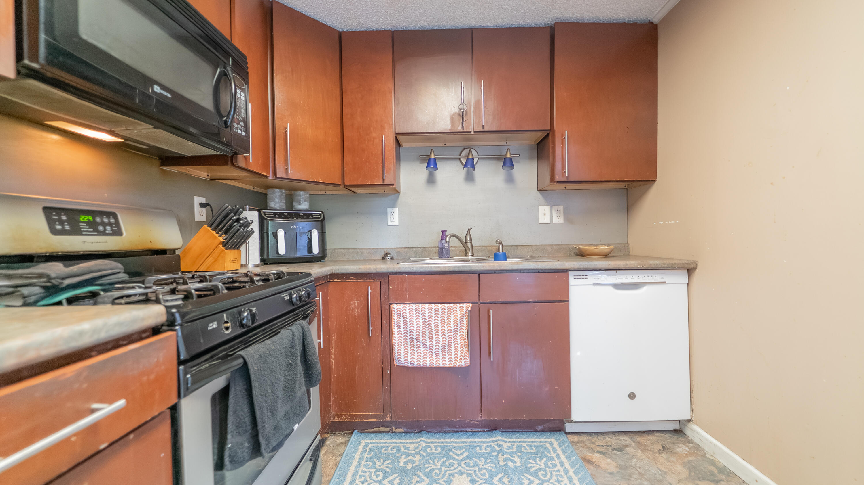 629 West South Street Crown Point, IN 46307 - Photo 9 of 23 a kitchen with stainless steel appliances granite countertop a stove and a refrigerator