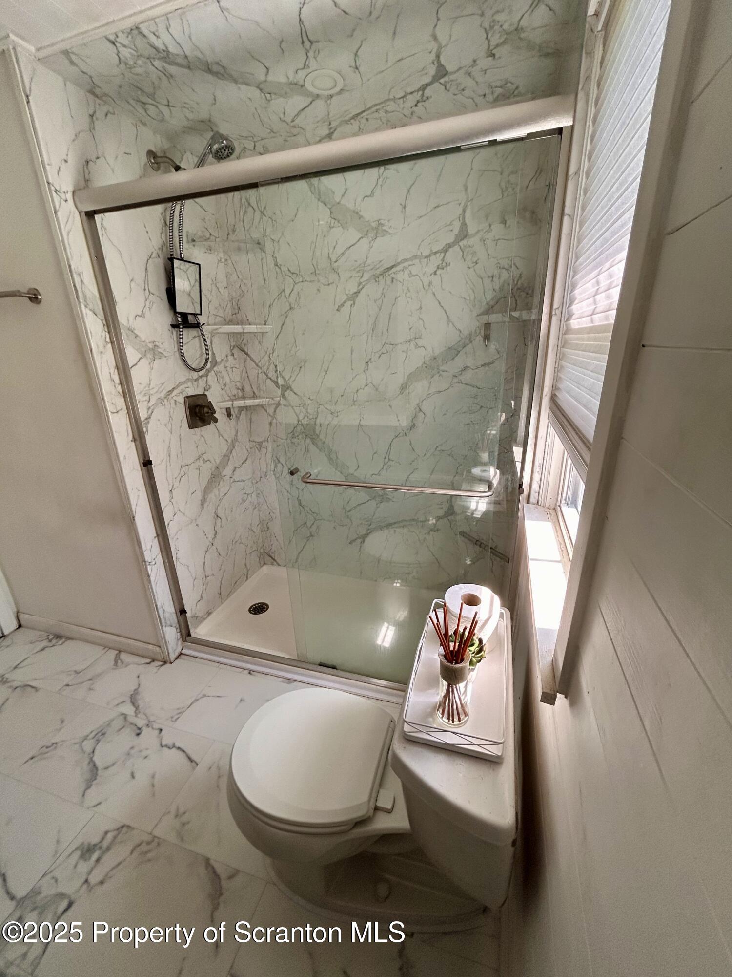 4 East Lemon Road Tunkhannock, PA 18657 - Photo 12 of 25 a bathroom with a toilet sink and shower