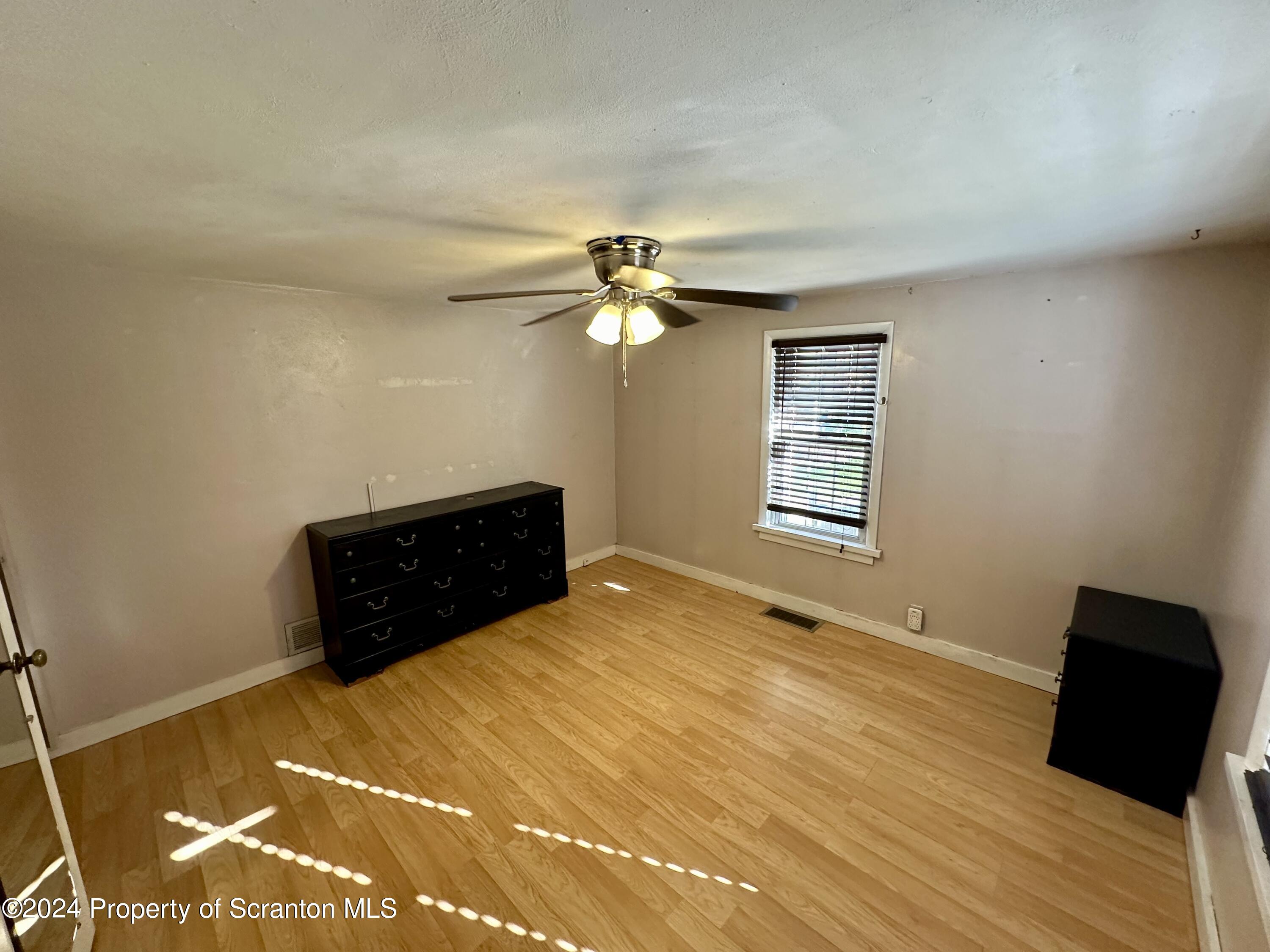 4 East Lemon Road Tunkhannock, PA 18657 - Photo 16 of 25 a bedroom with a bed and a dresser