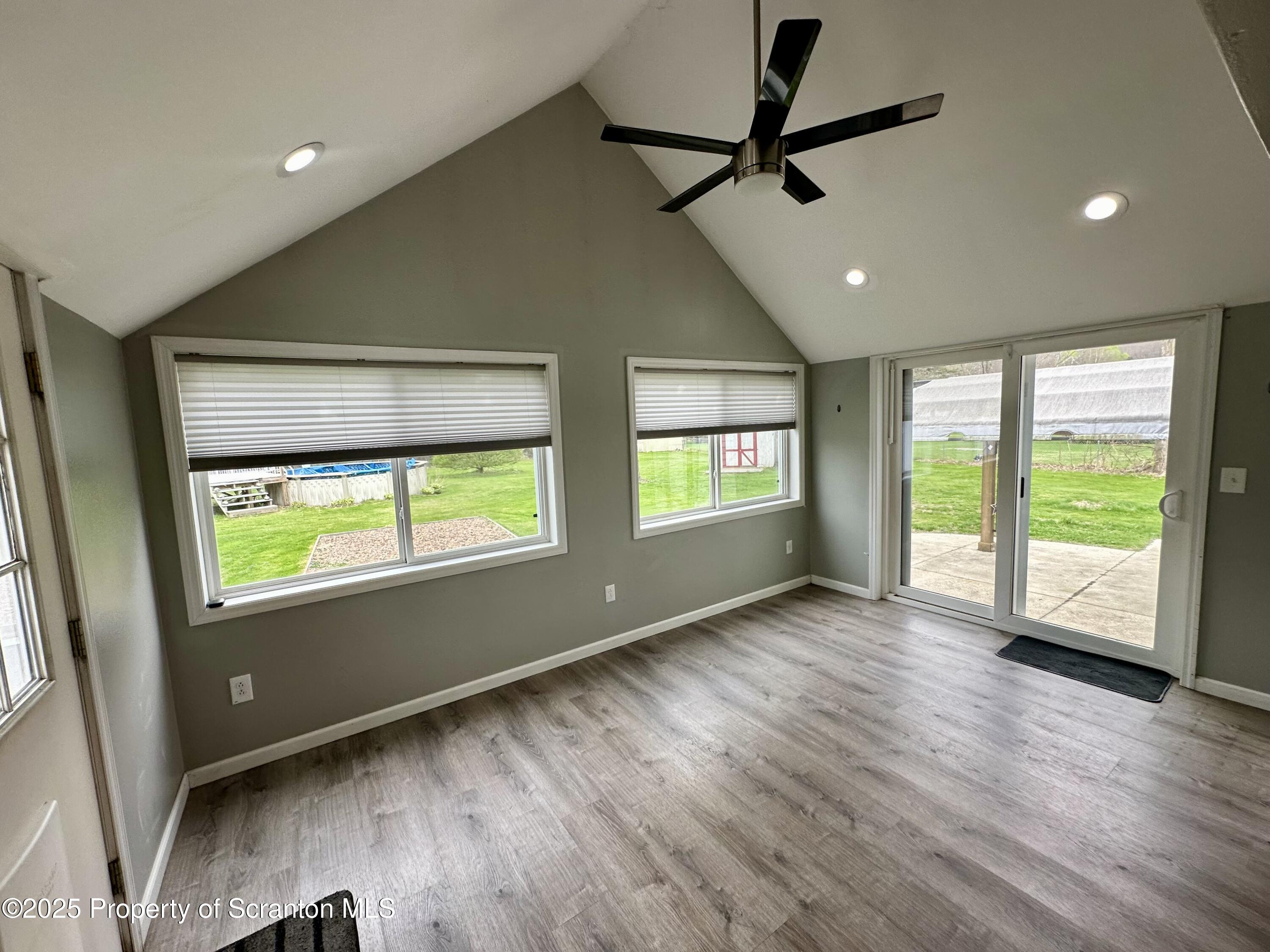 4 East Lemon Road Tunkhannock, PA 18657 - Photo 7 of 25 a view of an empty room with a window and wooden floor