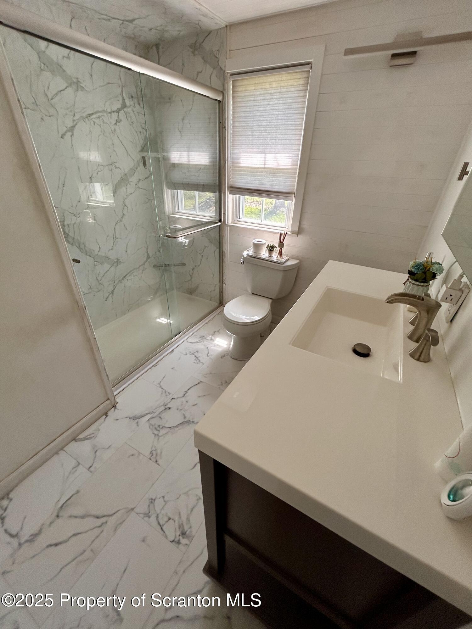4 East Lemon Road Tunkhannock, PA 18657 - Photo 9 of 25 a bathroom with a sink and a mirror