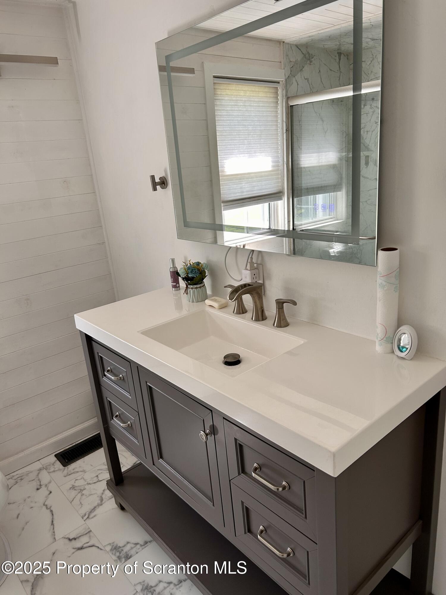 4 East Lemon Road Tunkhannock, PA 18657 - Photo 10 of 25 a bathroom with a sink and a mirror