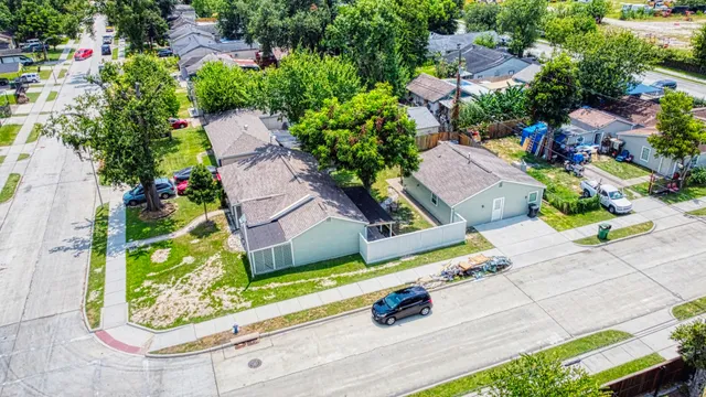 an aerial view of residential house with outdoor space and street view