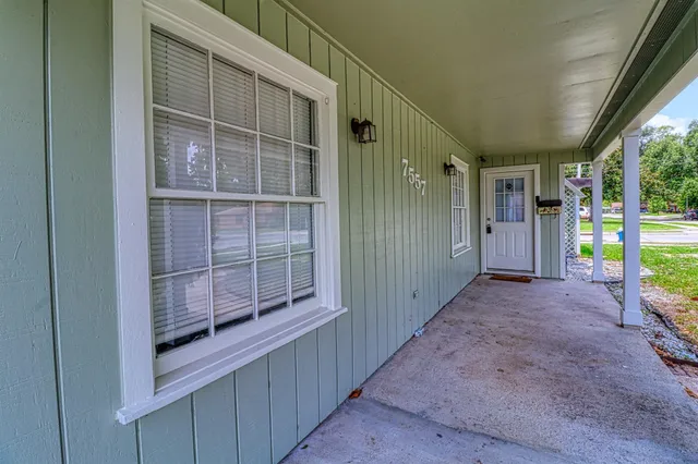 a view of entryway with wooden door