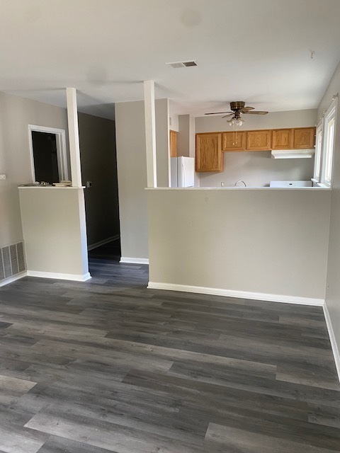 809 Vine Street Joliet, IL 60435 - Photo 6 of 8 a view of an empty room with wooden floor and a window
