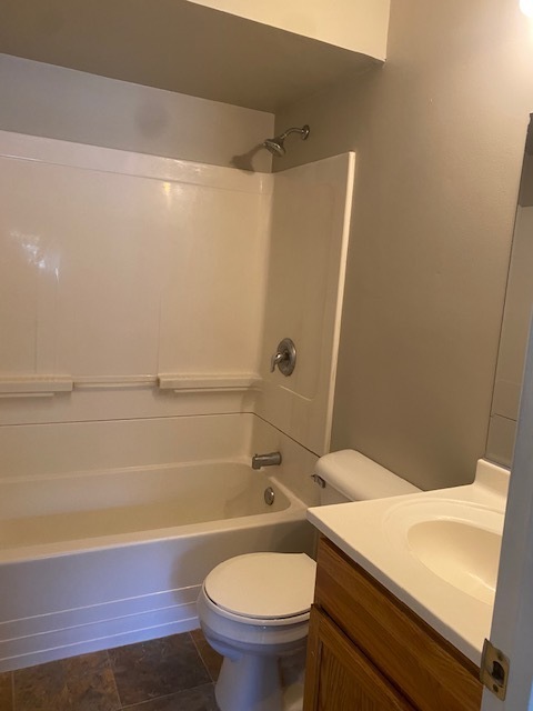 809 Vine Street Joliet, IL 60435 - Photo 7 of 8 a bathroom with a sink a toilet and shower