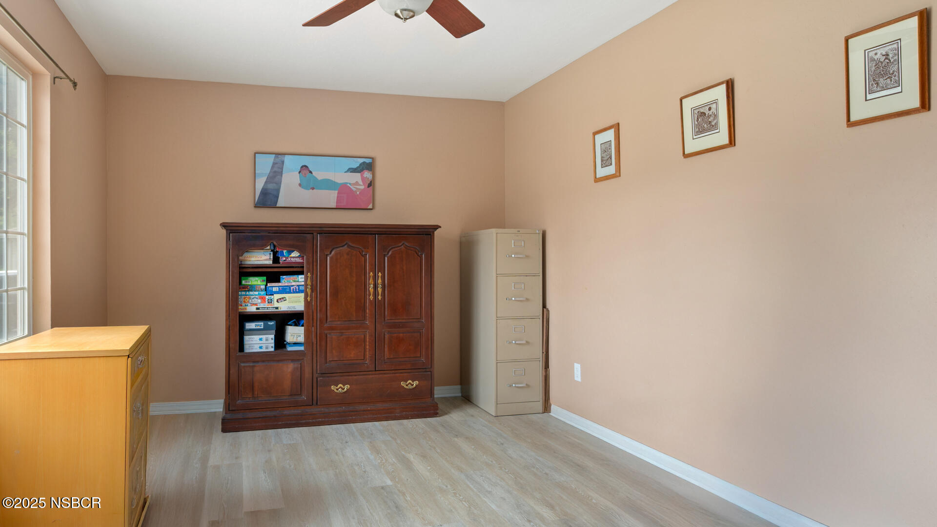 258 Dairyland Road Buellton, CA 93427 - Photo 12 of 19 a view of an empty room with window and wooden floor