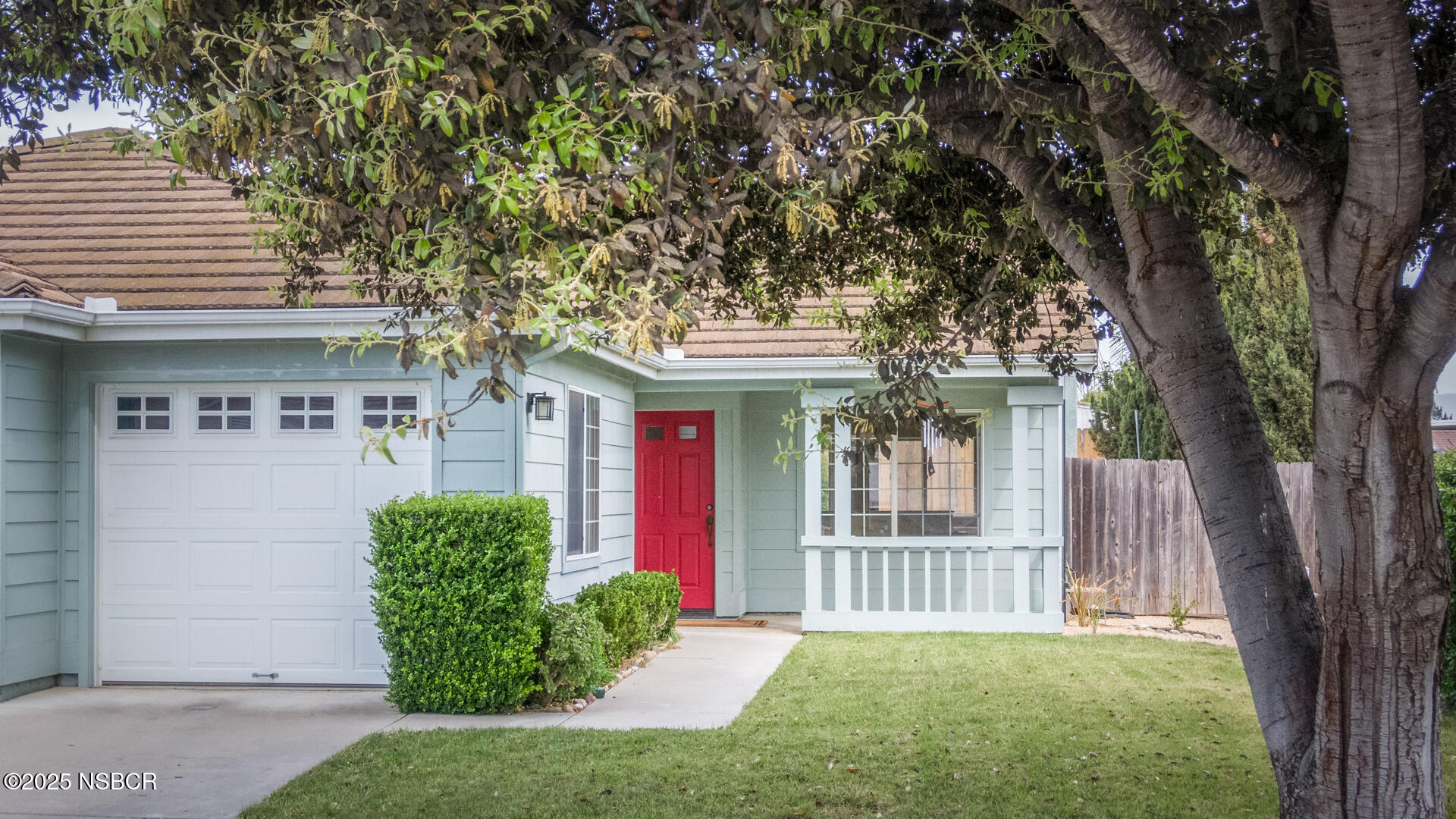 258 Dairyland Road Buellton, CA 93427 - Photo 16 of 19 a view of a house with a small yard and a large tree