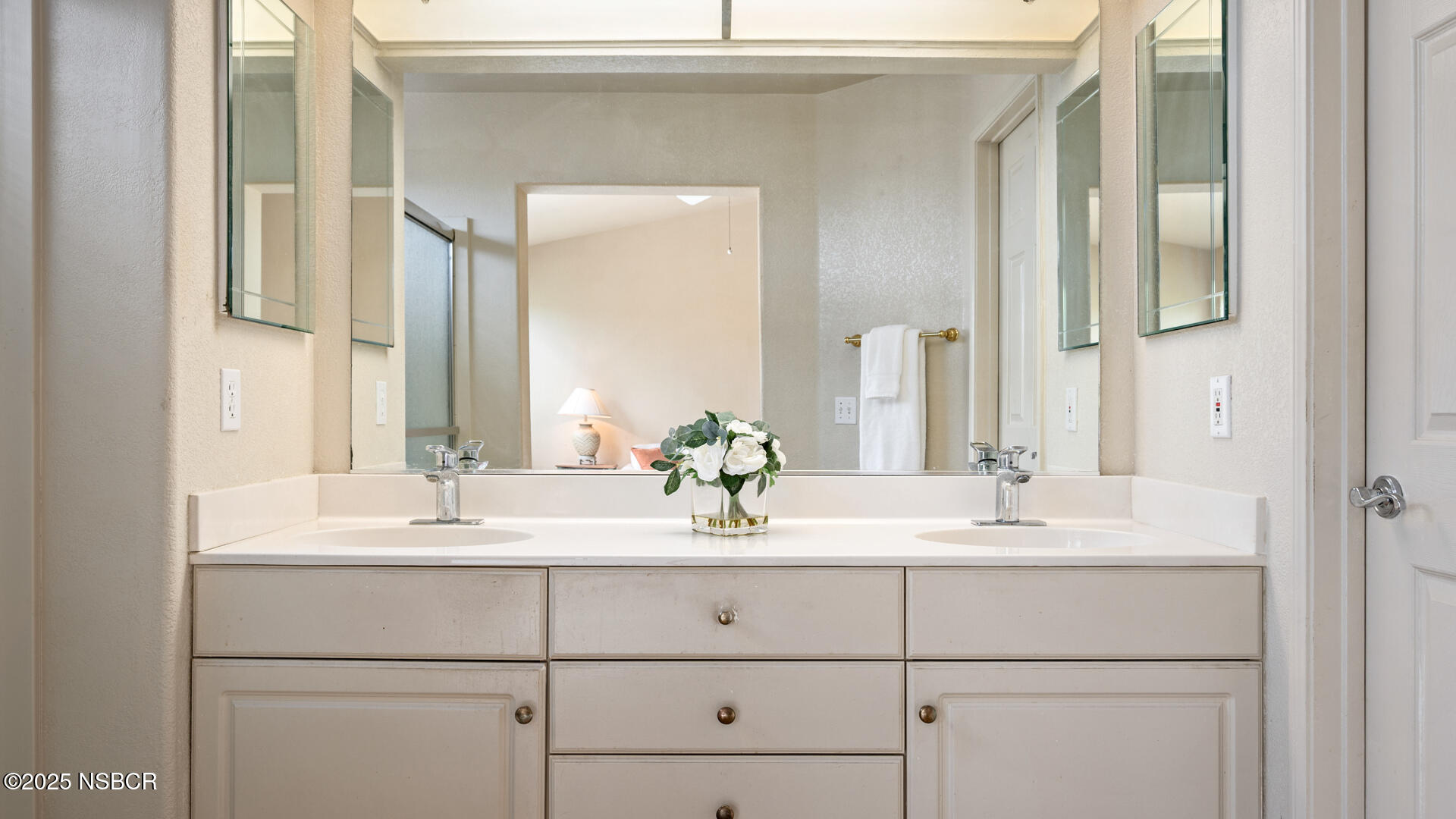 258 Dairyland Road Buellton, CA 93427 - Photo 8 of 19 a bathroom with double vanity sinks and a mirror