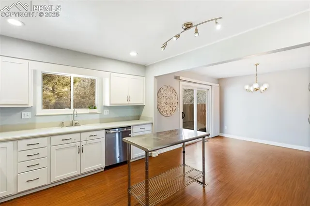a kitchen with sink cabinets and window