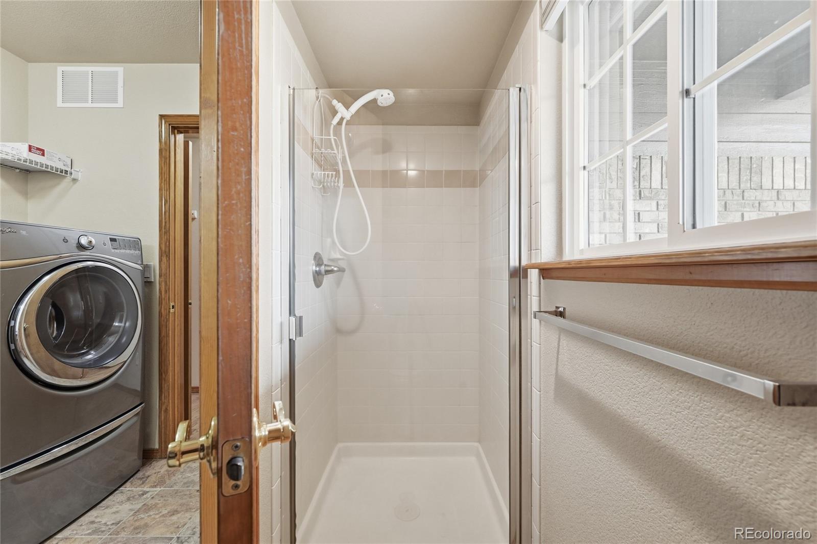 9288 Rockingham Drive Peyton, CO 80831 - Photo 21 of 49 a bathroom with a bathtub and a shower