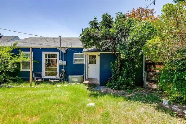 a view of a house with pool and garden