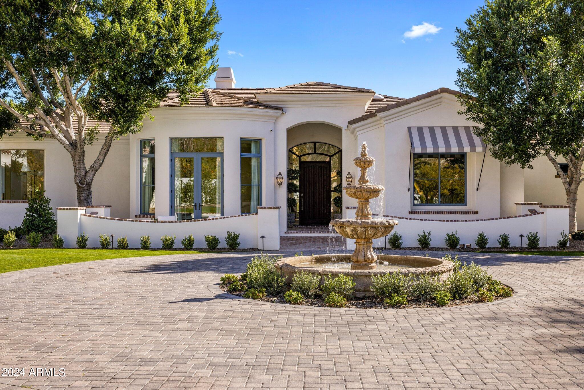 5121 East Rockridge Road Phoenix, AZ 85018 - Photo 1 of 10 a front view of a house with garden