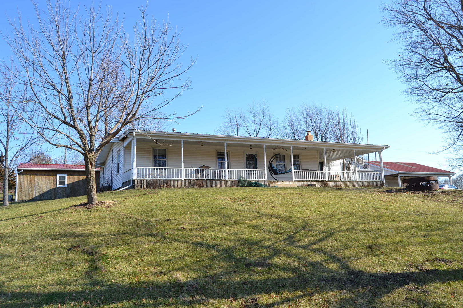 5126 Park Road Clinton, IL 61727 - Photo 18 of 25 a front view of a house with a garden