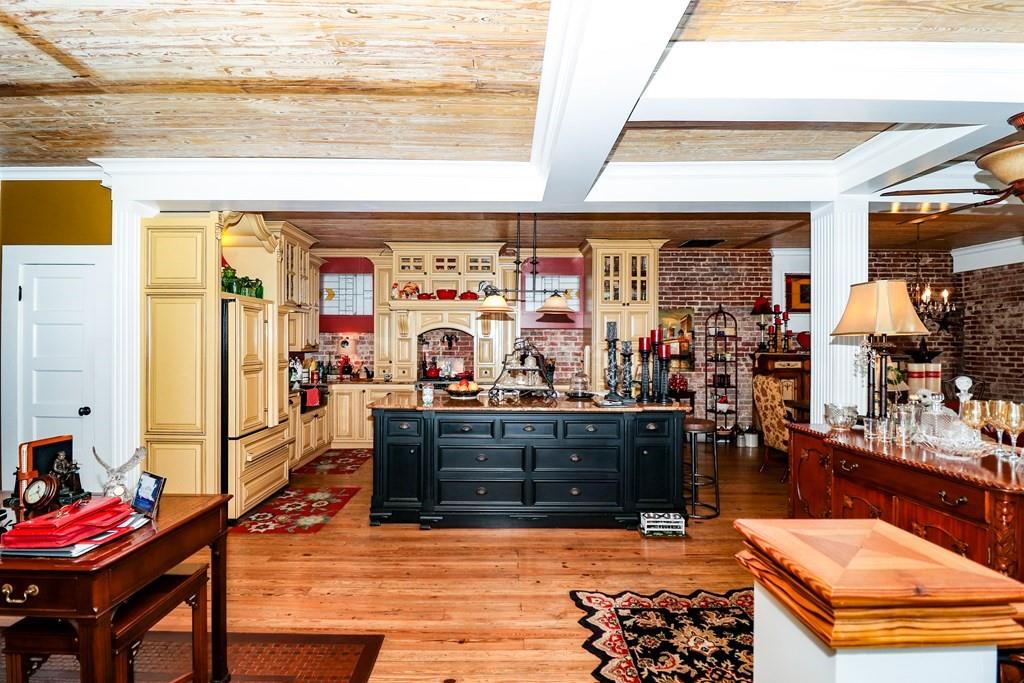 114 North 3rd Avenue Chatsworth, GA 30705 - Photo 12 of 59 a living room with furniture a rug and a fireplace