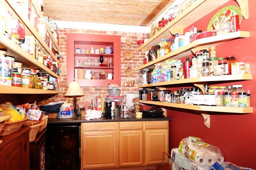 114 North 3rd Avenue Chatsworth, GA 30705 - Photo 23 of 59 a kitchen area with lots of clutter and cabinets