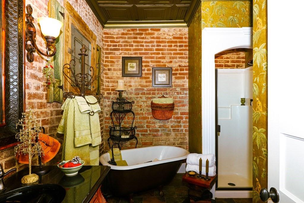 114 North 3rd Avenue Chatsworth, GA 30705 - Photo 26 of 59 a bathroom with a sink and a mirror