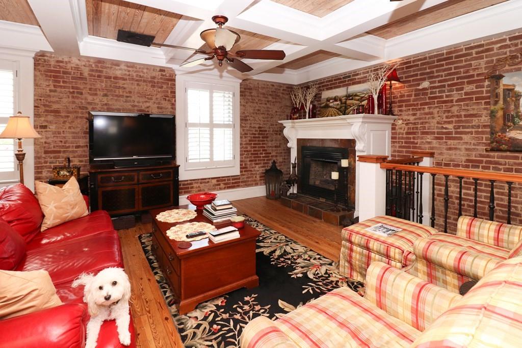 114 North 3rd Avenue Chatsworth, GA 30705 - Photo 43 of 59 a living room with fireplace furniture and a flat screen tv