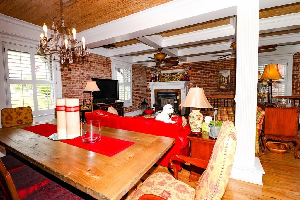 114 North 3rd Avenue Chatsworth, GA 30705 - Photo 8 of 59 a room with musical instrument pool table furniture and a chandelier