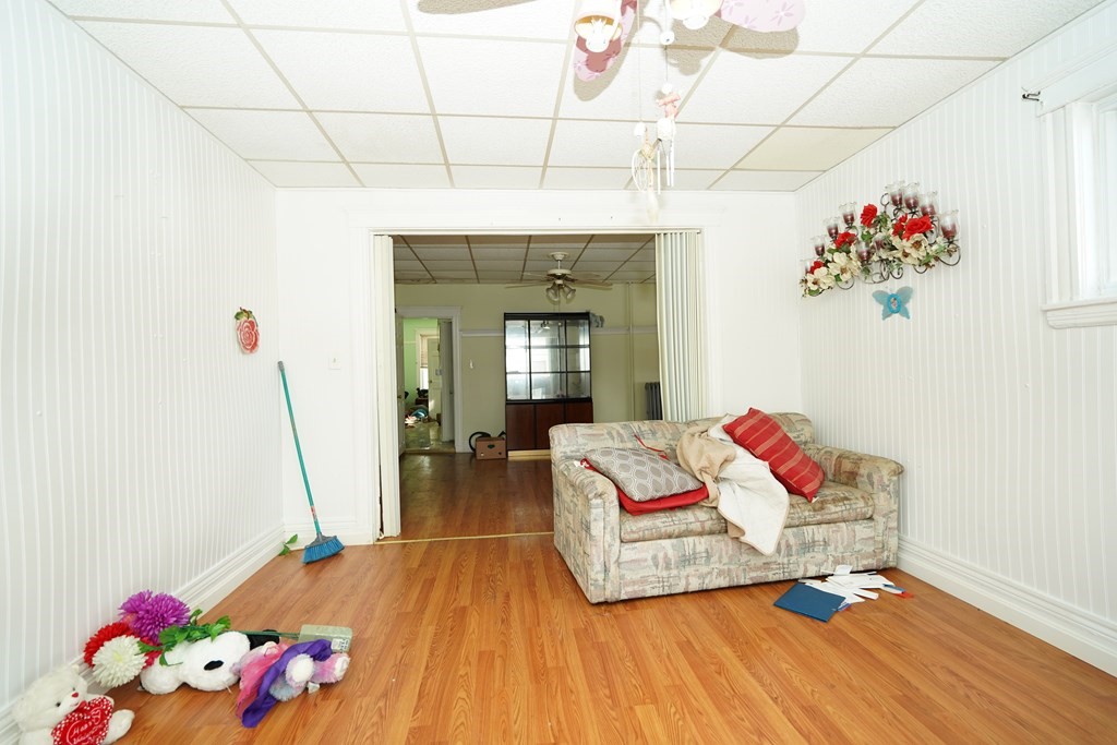 298 Lawrence Street Lawrence, MA 01841 - Photo 11 of 42 a living room with toys