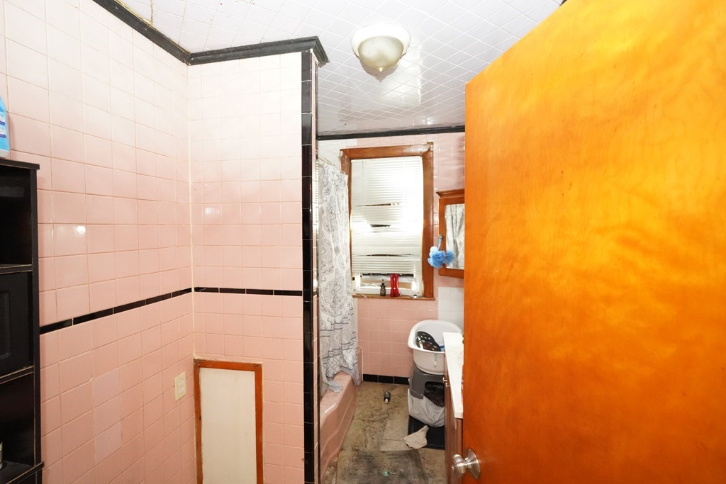 298 Lawrence Street Lawrence, MA 01841 - Photo 22 of 42 a bathroom with a shower