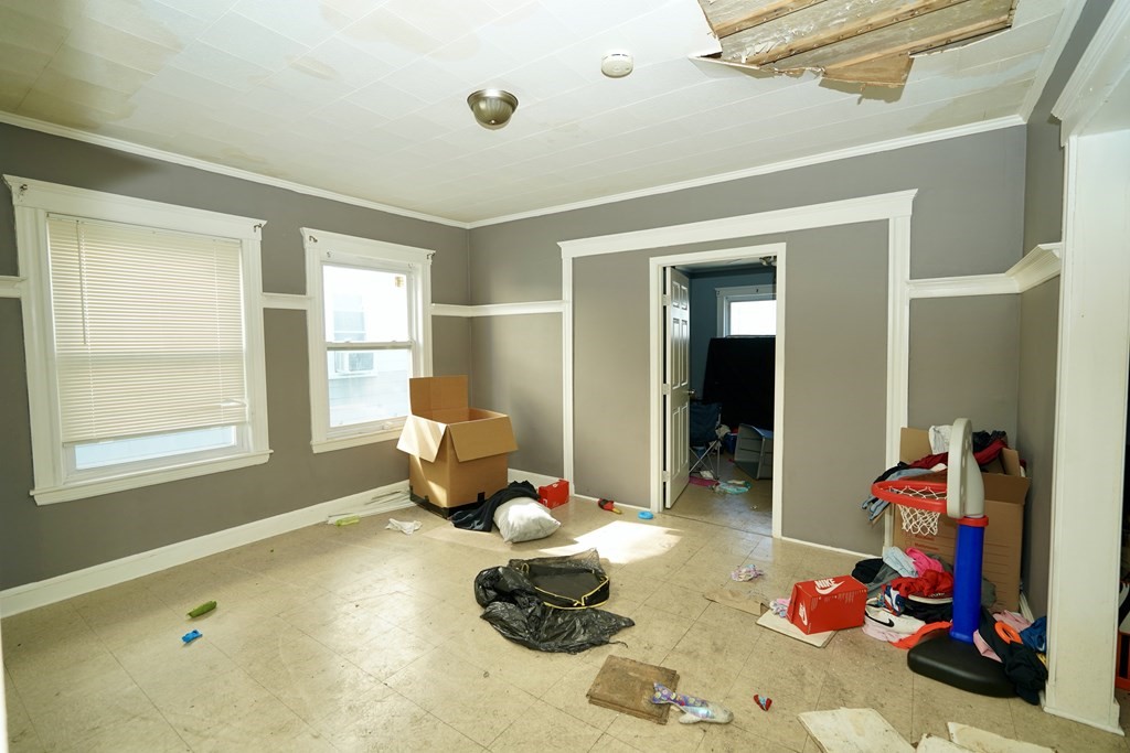 298 Lawrence Street Lawrence, MA 01841 - Photo 23 of 42 a room with furniture toys and a large window