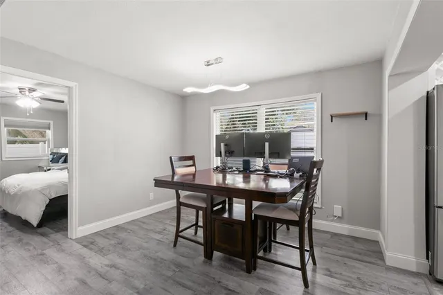 a view of a dining room with furniture window and wooden floor