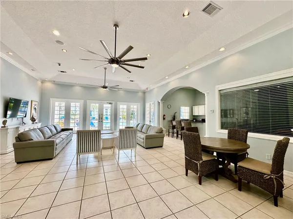 a kitchen with stainless steel appliances kitchen island granite countertop a stove a sink and a refrigerator