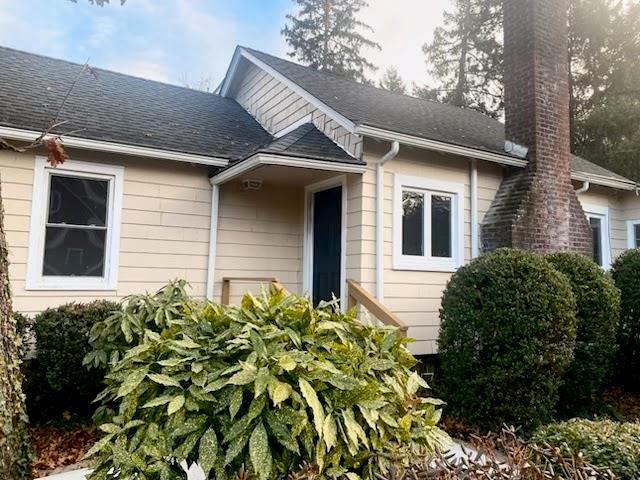 9 Erland Road Stony Brook, NY 11790 - Photo 1 of 1 View of side of property with a chimney and roof with shingles