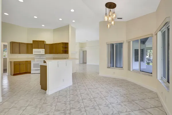 a view of room with window and ceiling fan