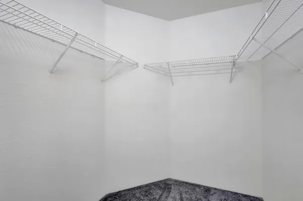 a bathroom with a double vanity sink mirror and bathtub