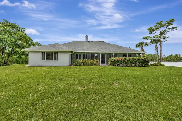 front view of a house with a garden