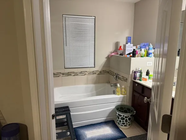 a bathroom with a bathtub and shower