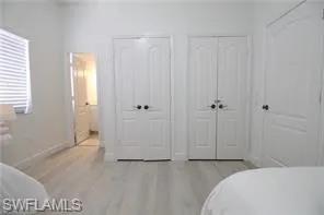 a bedroom with a bed and a shower