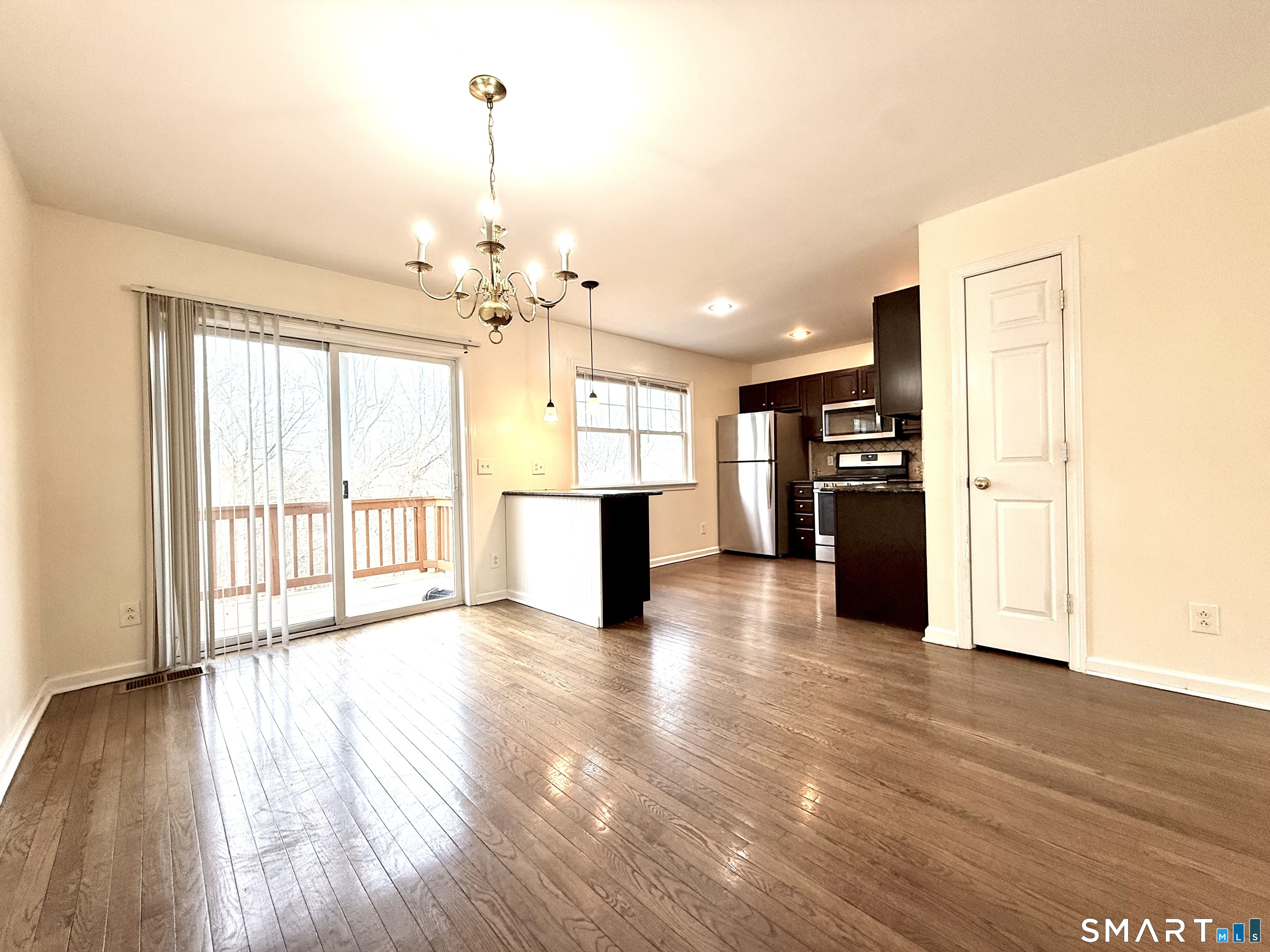 15 Scuppo Road, Unit 603 Danbury, CT 06811 - Photo 9 of 29 a view of a kitchen with a stove cabinets and wooden floor